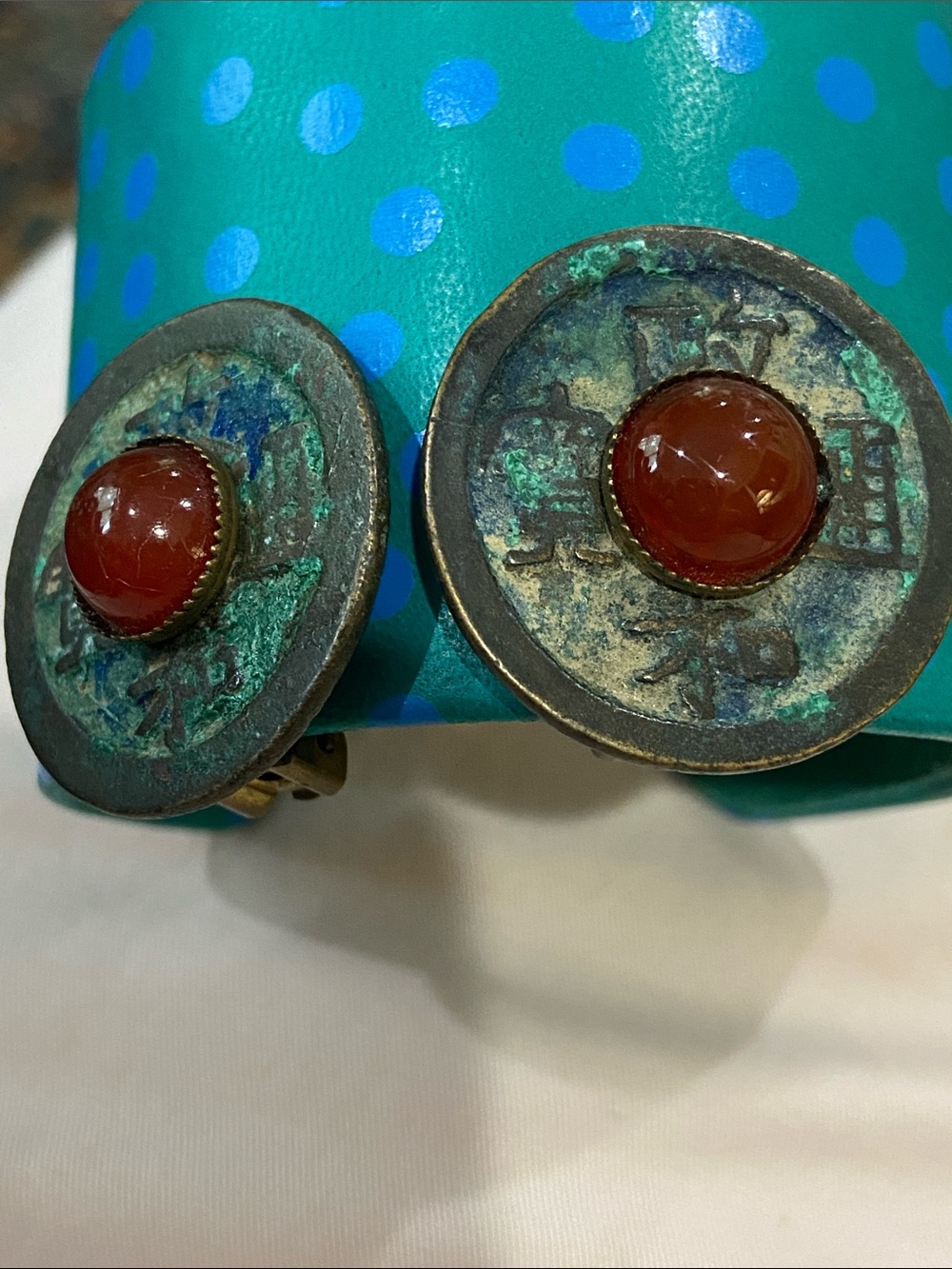 Reproduction Chinese Coin clip on earrings by Jan Michaels, San Francisco.